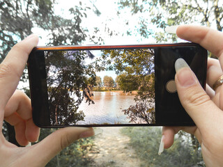 Shoot on the phone in the first person. Shooting a landscape on behalf of the photographer