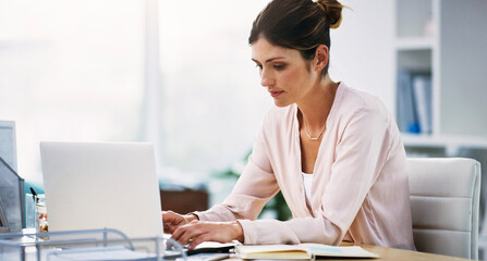 Email, communication and business woman with a laptop for networking, planning and working in administration. Corporate, internet and employee typing on a computer as a receptionist or secretary