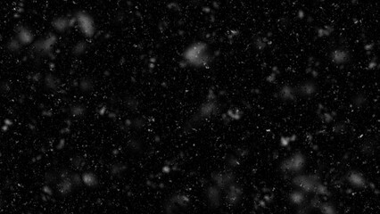 Fototapeta na wymiar Falling snow isolated on black background. Falling snow at night. Bokeh lights on black background, flying snowflakes in the air. Winter weather. Overlay texture.