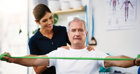 Fitness, rehabilitation and physiotherapy with a senior man patient and female therapist at work in a clinic. Health, wellness and consultant with a woman physio working with a male on recovery