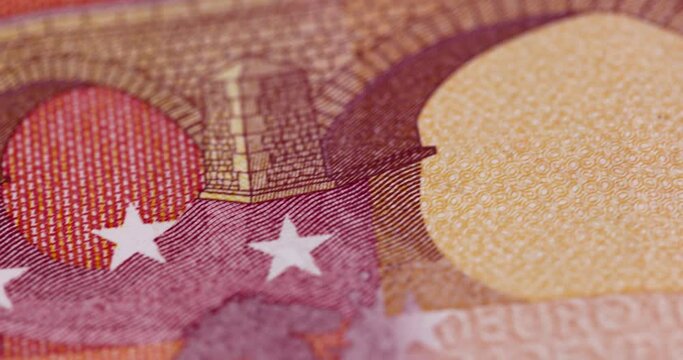 Cash ten euro banknote close-up , details of the 10 euro banknote of the European Union moved by hands