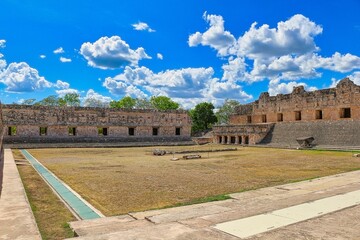 Scenery of the Quadrangle of the Nuns, archaeological zone of Uxmal under the blue cloudy sky