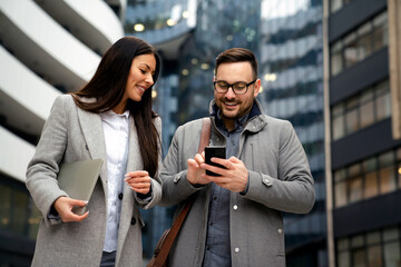 Young business people talking and working outdoor. Business woman man lifesytle city concept.