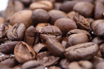 Close-up of the dry coffee beans. Background. Texture