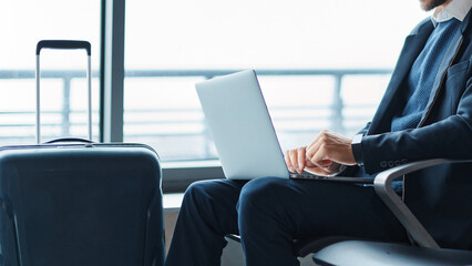 business man using his laptop during a business trip.