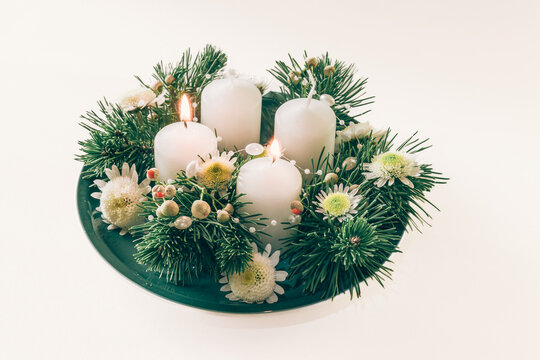 second advent candle burning on round wreath