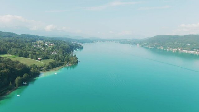 wide aerial drone footage of the famous W&ouml;rthersee in Austria