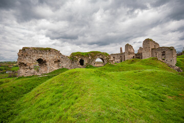Fototapeta na wymiar Ruins of the Skala-Podilsky castle against a cloudy sky in the Ternopil region