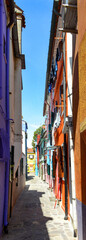 Alley in the colorful city of Burano Island, taly