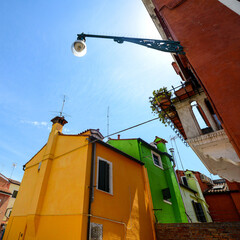 Fototapeta na wymiar Colorful houses on the main street of burano Island,