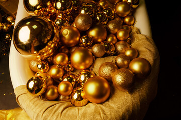 Bathtub full of golden balls. Vintage bright bathroom decorated with festive golden balls. New Year, Christmas bathroom interior.