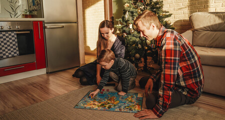 Happy family playing board game walker