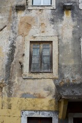 Fototapeta na wymiar Antique window on an old wall