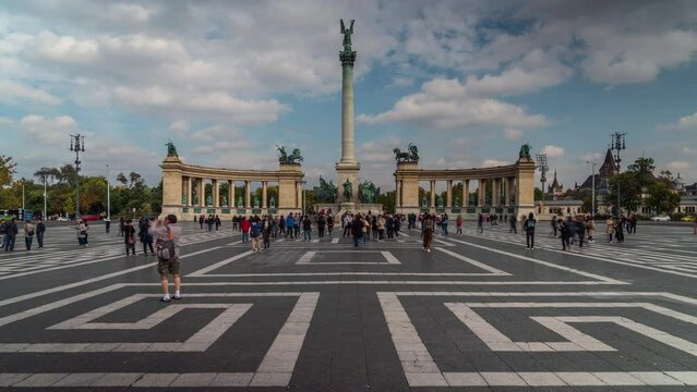 Time lapse view of tourists exploring Heroes Square on a sunny day in Budapest, Hungary.