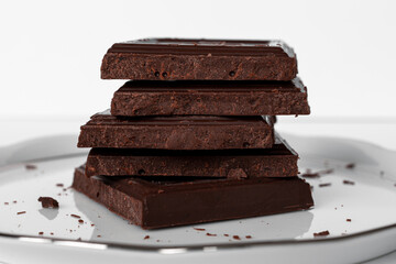 Pile of dark chocolate bar pieces.