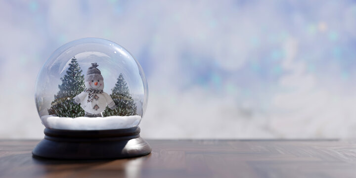 Snow globe with snowman. Christmas decoration on a table, copy space. l