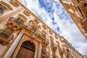 Fotobehang Low angle view of Via Maqueda Street in Palermo old town, Sicily, Italy © SerFF79