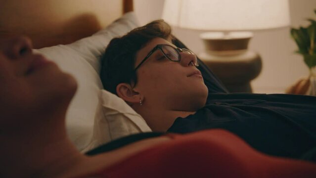 couple relax on bed
