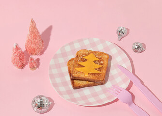 Christmas creative layout with pink christmas trees,melted cheese christmas tree on toast bread on...
