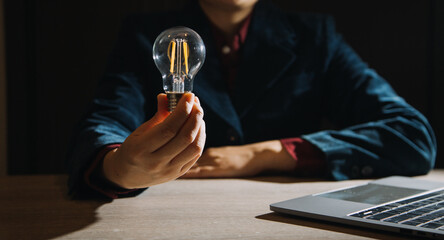 Innovation. Hands holding light bulb for Concept new idea concept with innovation and inspiration, innovative technology in science and communication concept,
