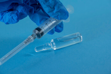 syringe with a medicine. syringe in hand
