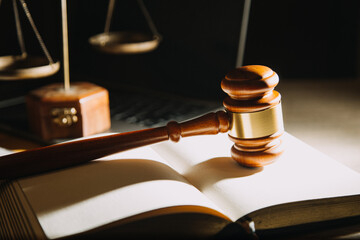 Business and lawyers discussing contract papers with brass scale on desk in office. Law, legal services, advice, justice and law concept picture with film grain effect