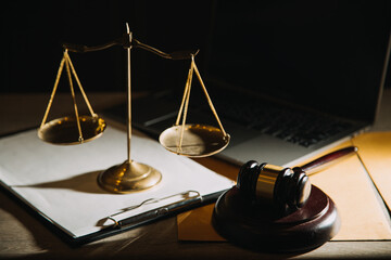 Business and lawyers discussing contract papers with brass scale on desk in office. Law, legal...