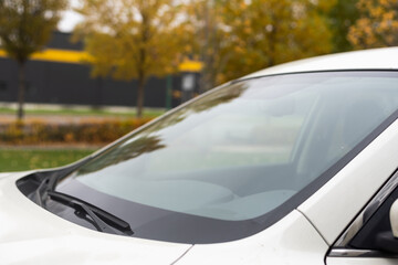 Fototapeta na wymiar close-up car windshield rain wipers, rainy weather and vehicles concept