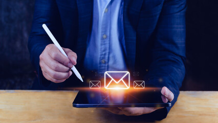 Businessman touching checking email online with virtual interface technology.Direct marketing, online message, E-mail, electronic mail,communication concept.