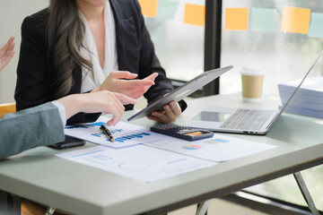 Portrait of Asian young female working on laptop at office