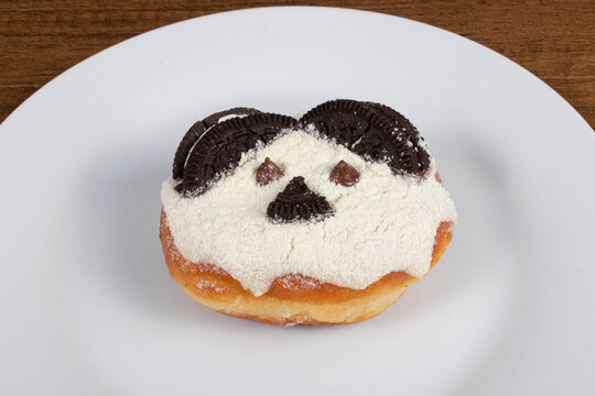 Fun teddy bear themed sweet donuts served on white plate. Close-up photography.