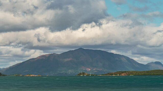Mont Dore rises above the Island of New Caledonia with a dramatic time lapse cloudscape overhead