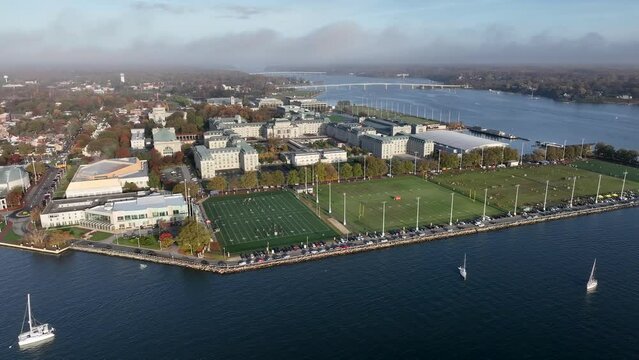 US Naval Academy and Marine Corps training facility in Annapolis Maryland by Severn River. Boats on water. Aerial view.