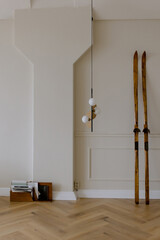 Wooden skis near the wall. Winter design concept