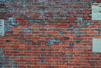 Close up of an old red brick wall 