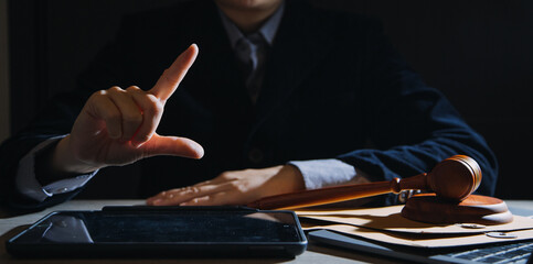 Business and lawyers discussing contract papers with brass scale on desk in office. Law, legal services, advice, justice and law concept picture with film grain effect