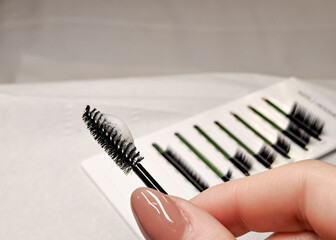 Obraz premium Black brush for eyelashes with lash shampoo foam ,cleaning lashes concept