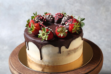Delicious cake with strawberries in chocolate glaze