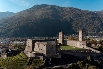 Obraz premium Aerial view of Bellinzona Castle atop the Swiss Alps taken from a drone on a sunny day. Fantastic view