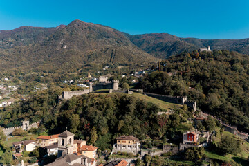 Aerial view of Bellinzona Castle atop the Swiss Alps taken from a drone on a sunny day. Fantastic view