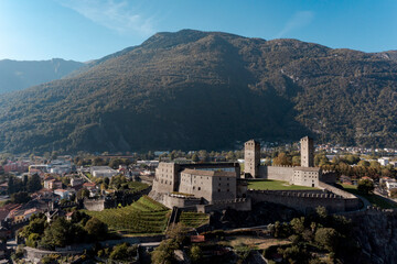 Obraz premium Aerial view of Bellinzona Castle atop the Swiss Alps taken from a drone on a sunny day. Fantastic view