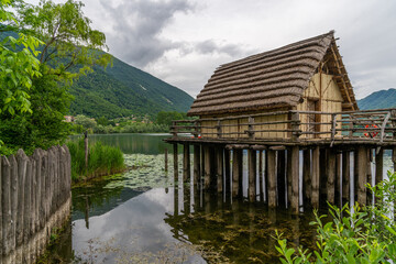 A hut next to a lake in an archaeological site in Lago di lago, Italy