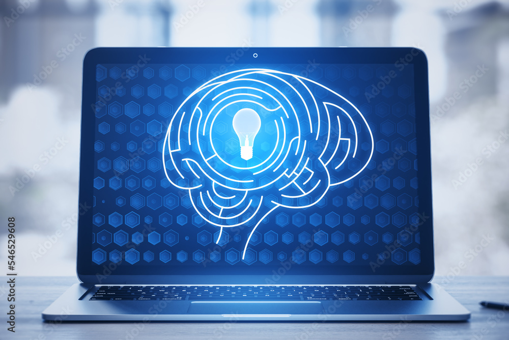 Aufkleber close up of laptop keyboard with digital light bulb with human brain inside glowing on blurry blue b