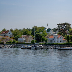 Boats at a pier next to a small village in Göteborg, Sweden
