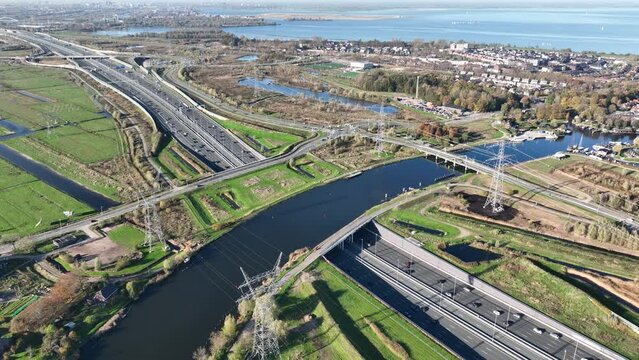 Aqueduct Vechtzicht Muiden in The Netherlands. Infrastructure road, highway. river, waterway crossing and tunnel. connection between Diemen and Almere. Aerial drone view.