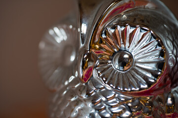 Close up of a metal sculpture of an owl
