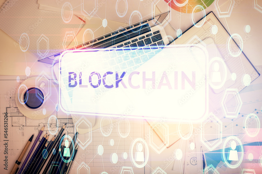 Poster blockchain theme hologram drawings over computer on the desktop background. top view. multi exposure