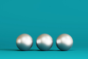 Three silver Christmas tree bauble isolated on a blue background. 3d render