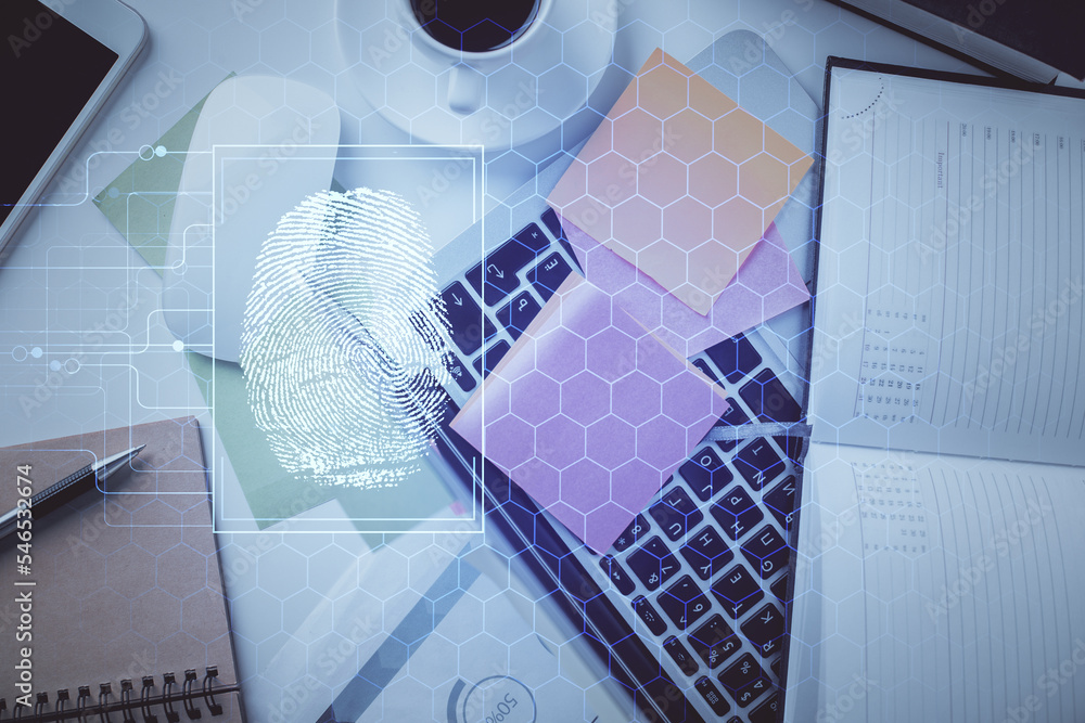 Poster Finger print over computer on the desktop background. Top view. Double exposure. Concept of securitization.