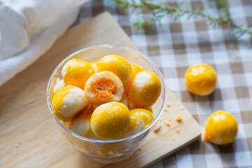 A cup of Sweet Filling with Salted Egg on a wooden cutting board, Asian food style concept.